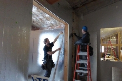 Coleman and Pete installing rigid insulation