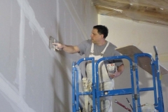 Patrick Hill taping the big wall of the lobby